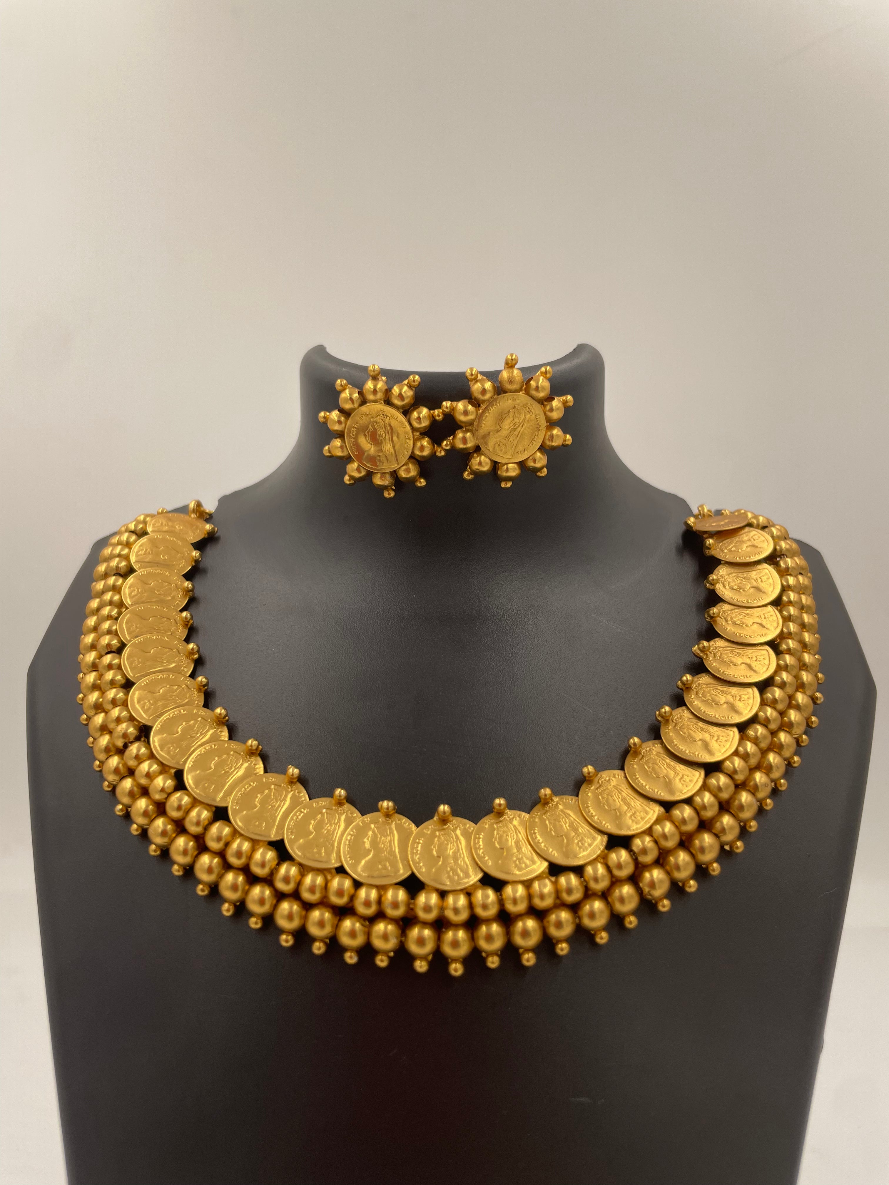 Vasudha Lakshmi kaasu mala necklace set with micro gold plating, Lakshmi coin motifs, golden bead detailing and matching stud earrings