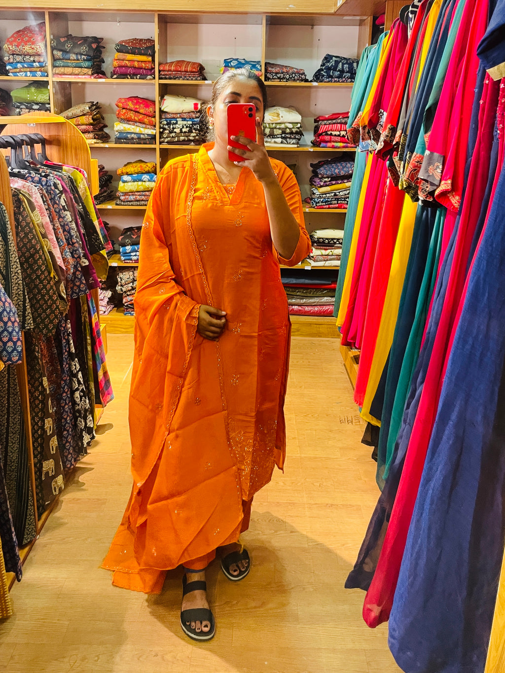 Pranavi orange embellished kurta set with sheer matching dupatta close-up