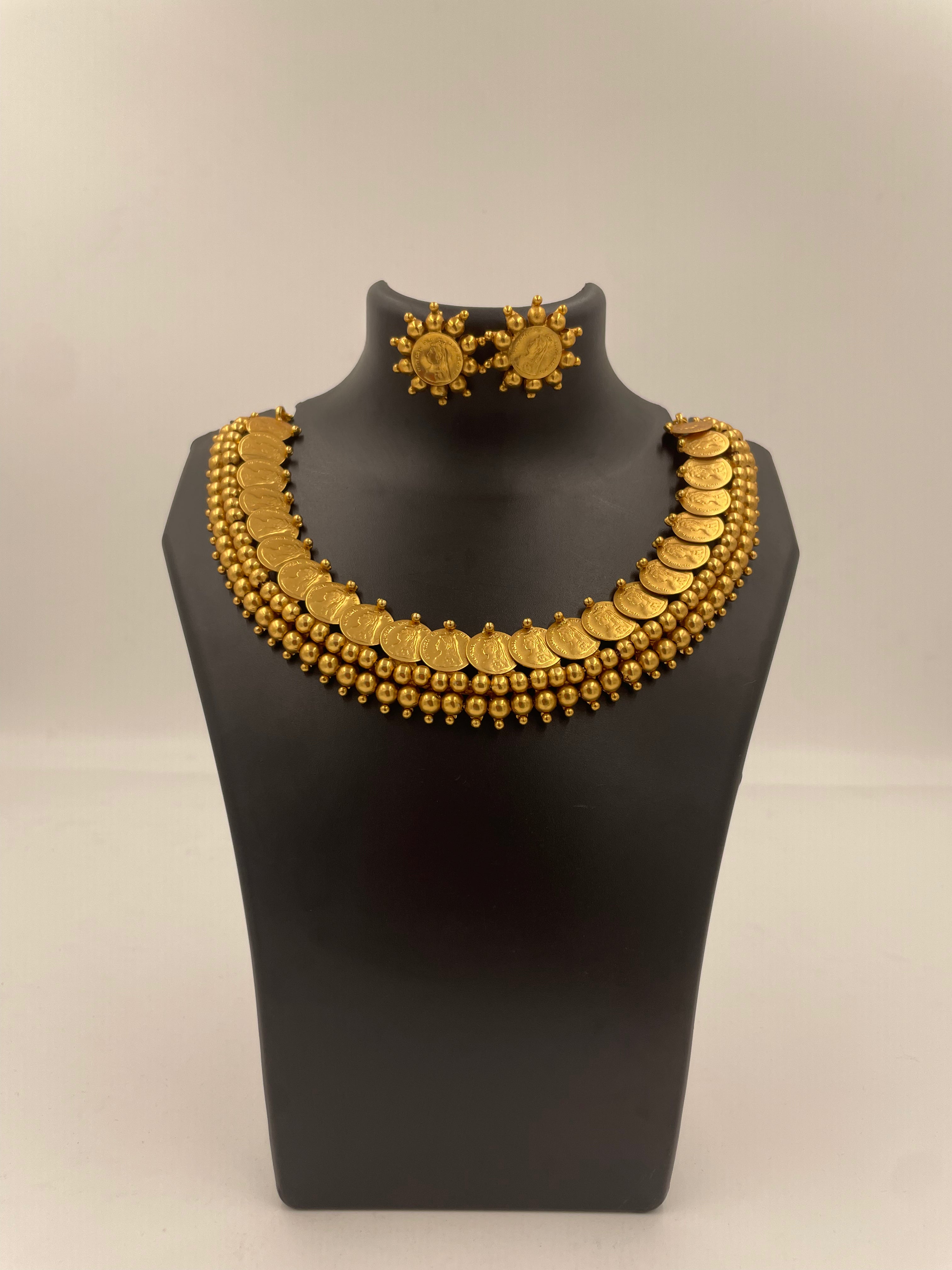 Vasudha Lakshmi kaasu mala necklace set with micro gold plating, Lakshmi coin motifs, golden bead detailing and matching stud earrings