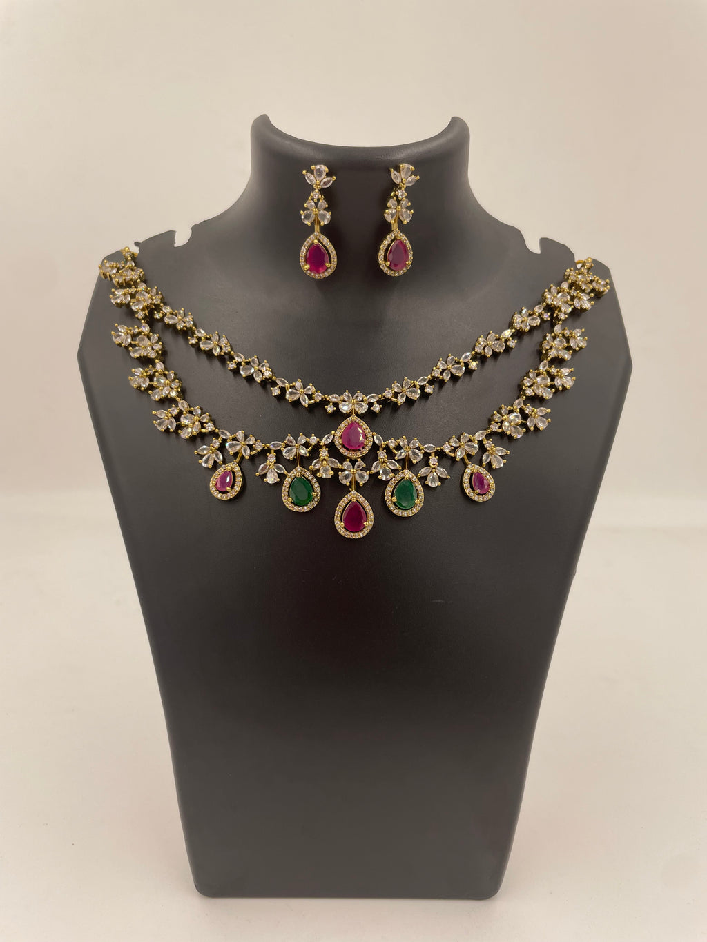 Aadhira double layer necklace set with pink and green teardrop stones and matching earrings