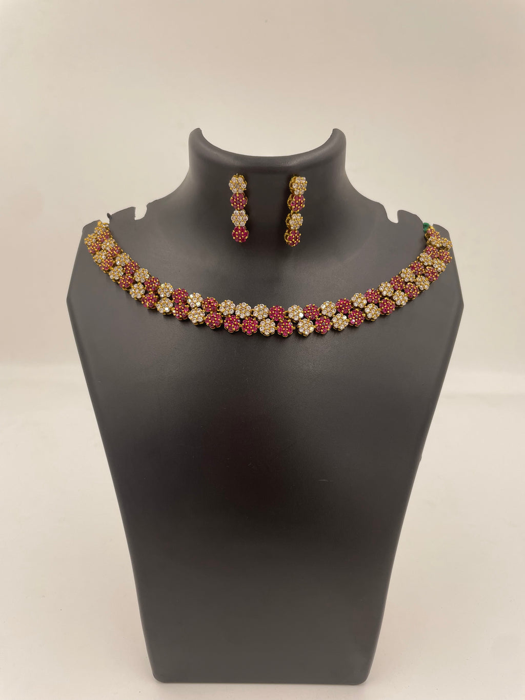 Diva Ruby Bloom necklace set with ruby and white AD stones and matching earrings