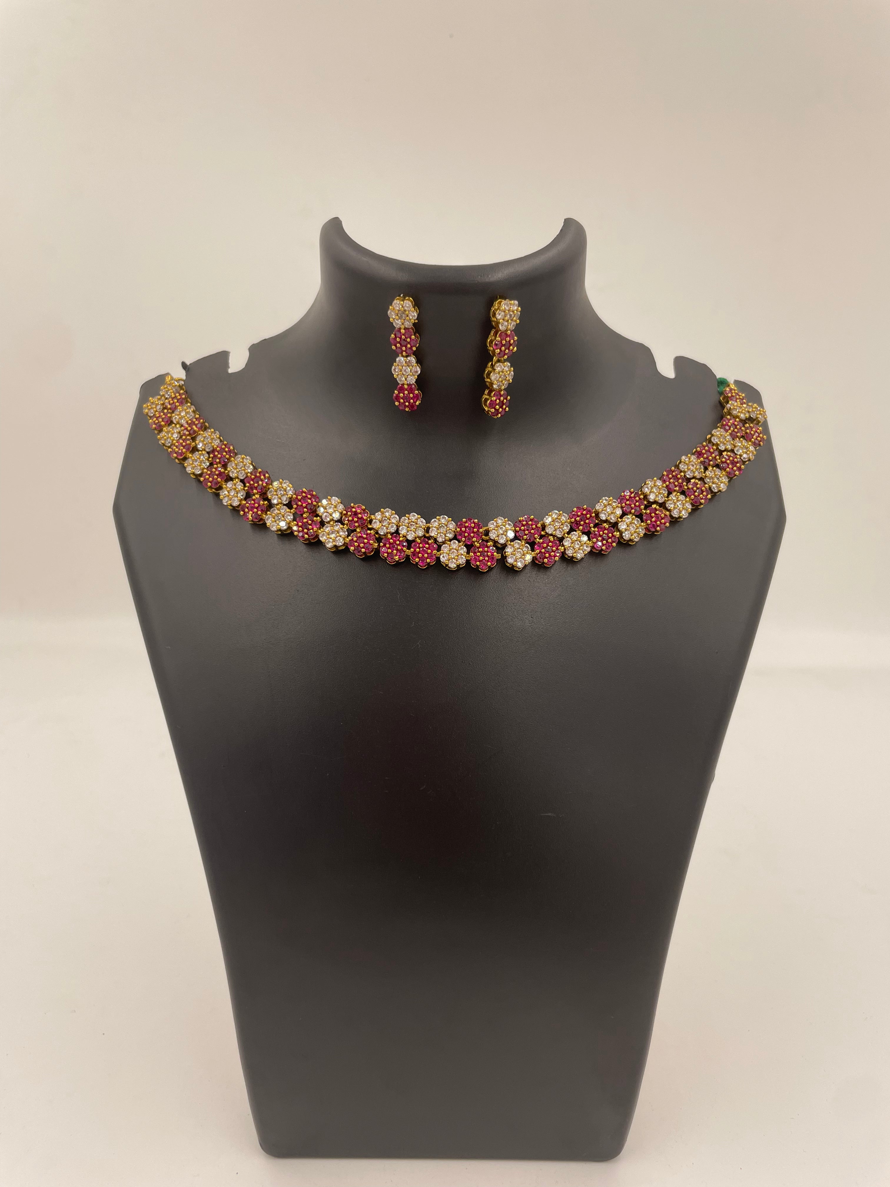 Diva Ruby Bloom necklace set with ruby and white AD stones and matching earrings
