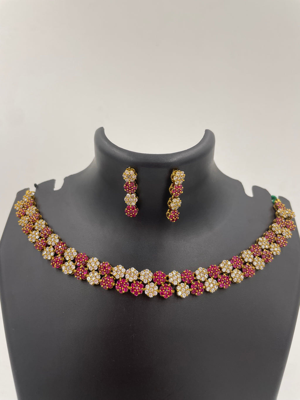 Diva Ruby Bloom necklace set with ruby and white AD stones and matching earrings