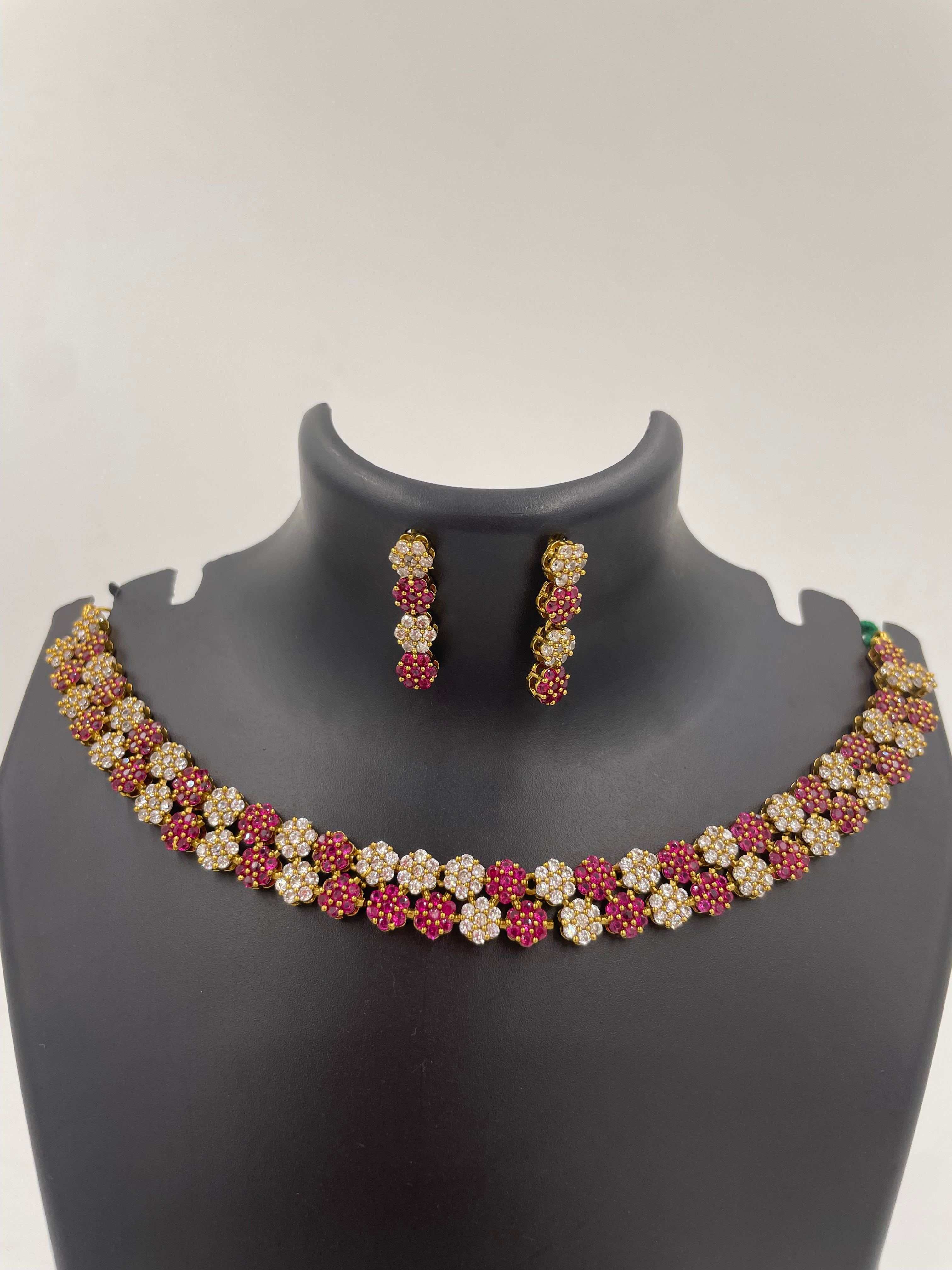 Diva Ruby Bloom necklace set with ruby and white AD stones and matching earrings