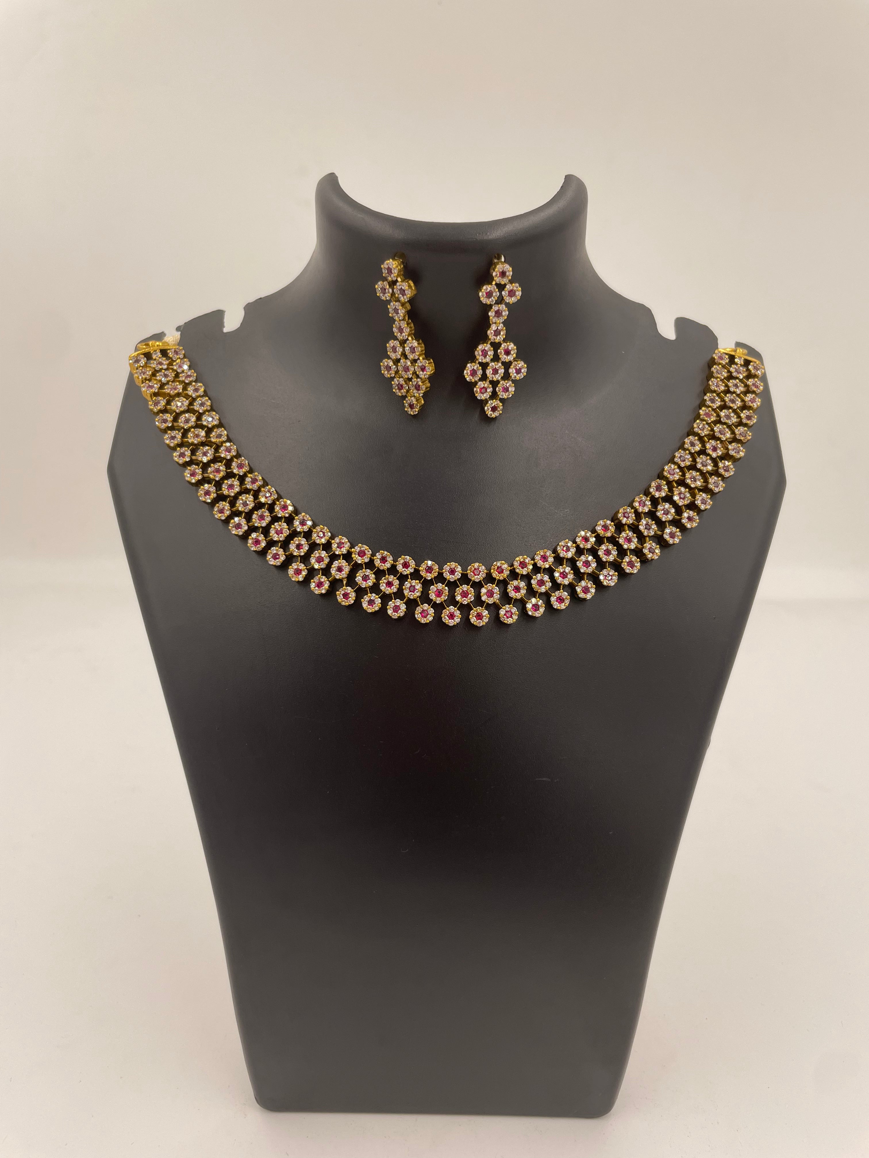 Aurelia premium ruby and white AD stone bridal necklace set with floral clusters and hanging earrings