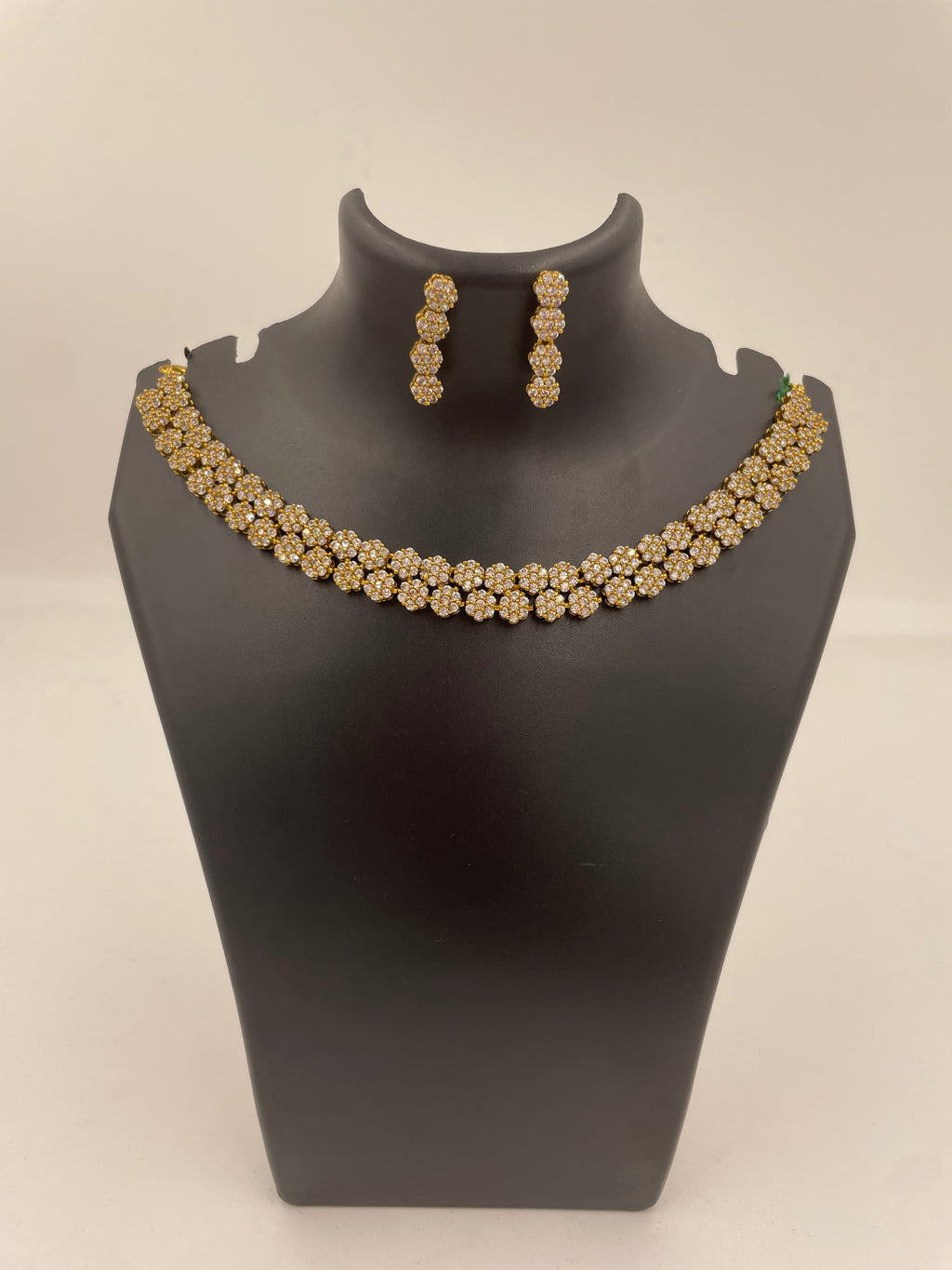 Anvi floral AD necklace set with sparkling white stones and matching earrings