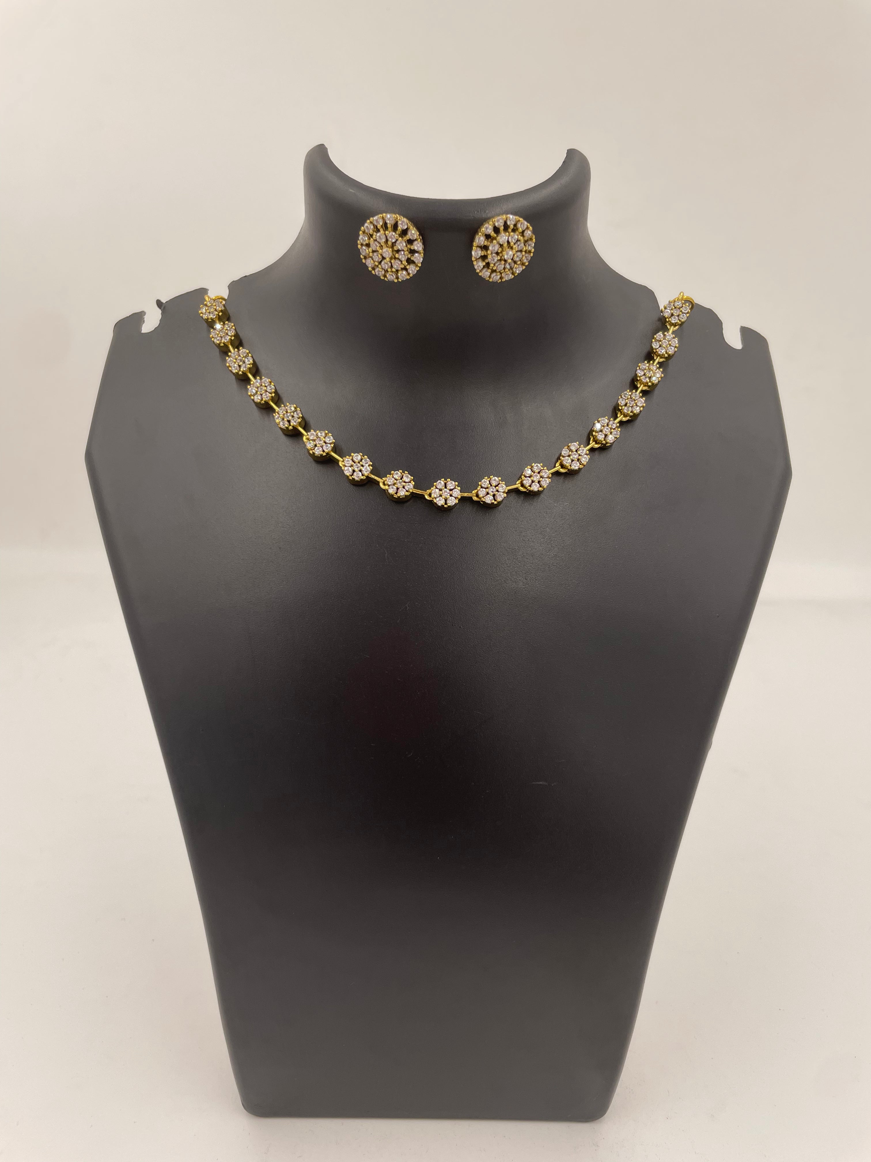Delicate gold-tone floral AD necklace with matching stud earrings