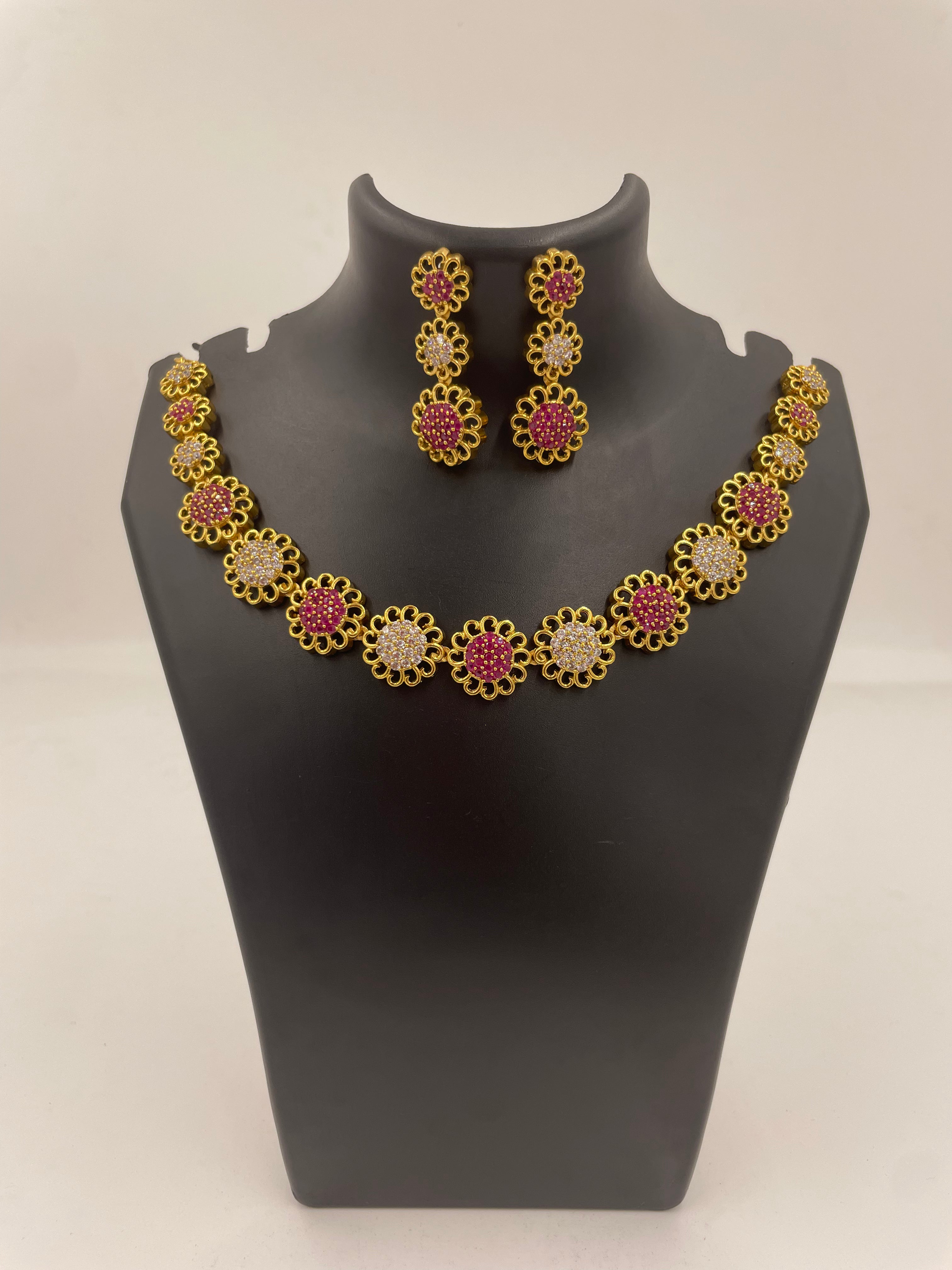 Ruhani micro gold plated necklace set with ruby and white AD stones and matching earrings