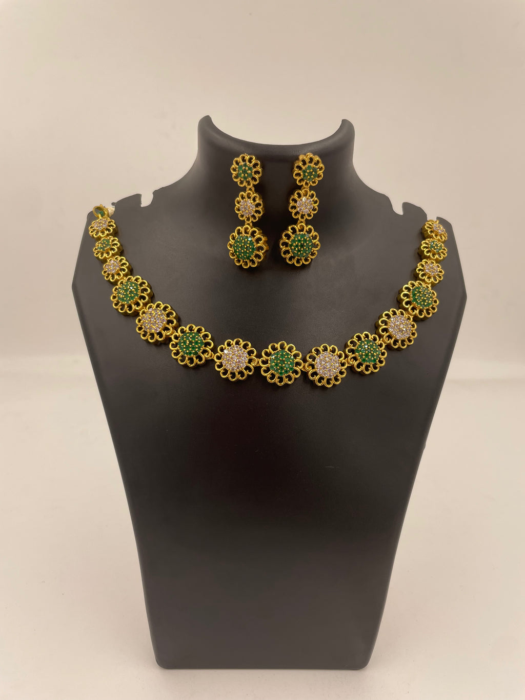 Neelima micro gold plated necklace set with green emerald and white AD stones with matching earrings