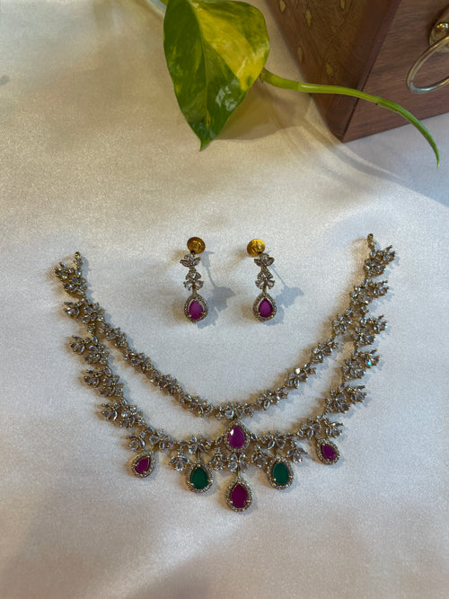 Aadhira double layer necklace set with pink and green teardrop stones and matching earrings