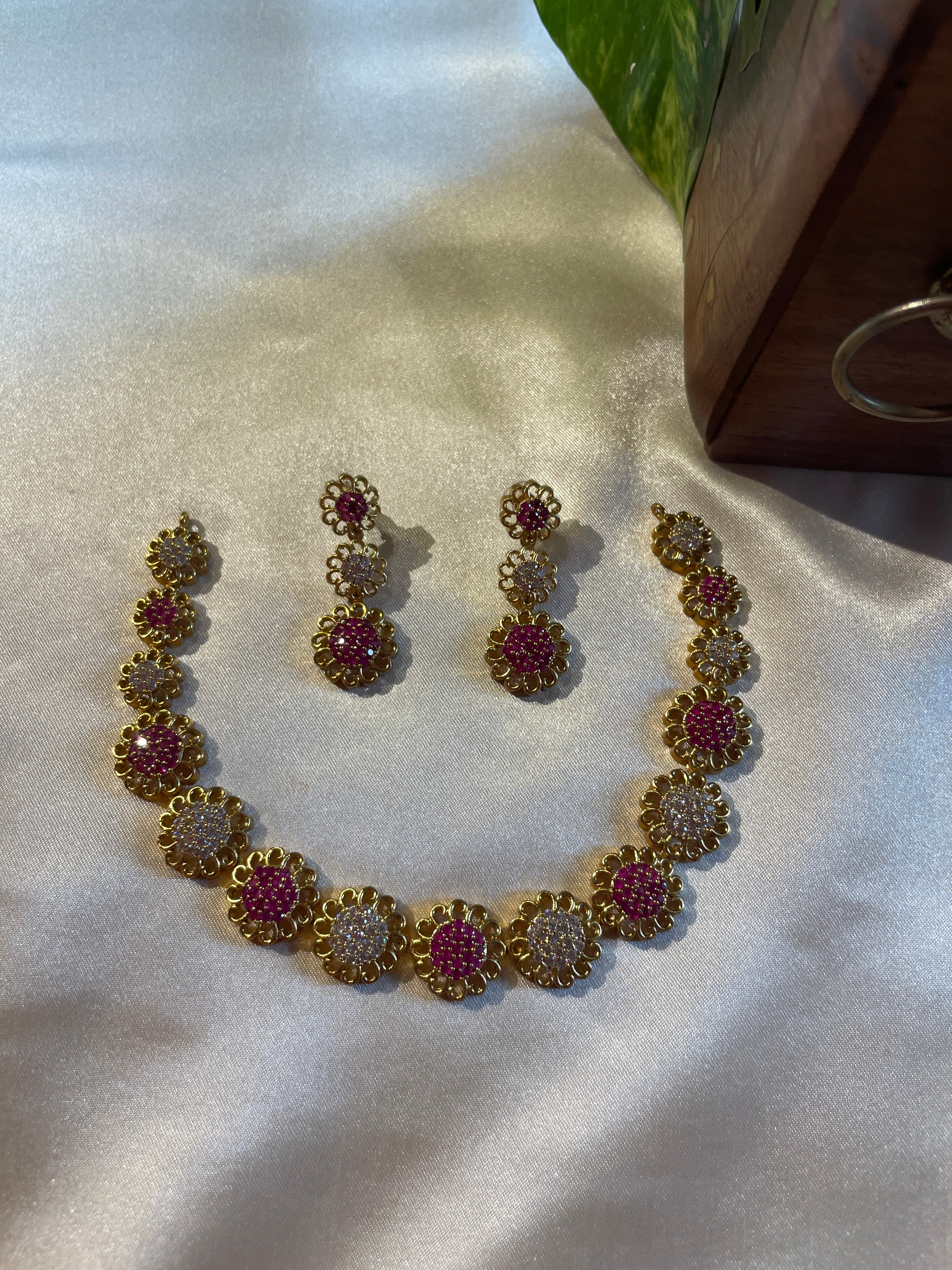 Ruhani micro gold plated necklace set with ruby and white AD stones and matching earrings