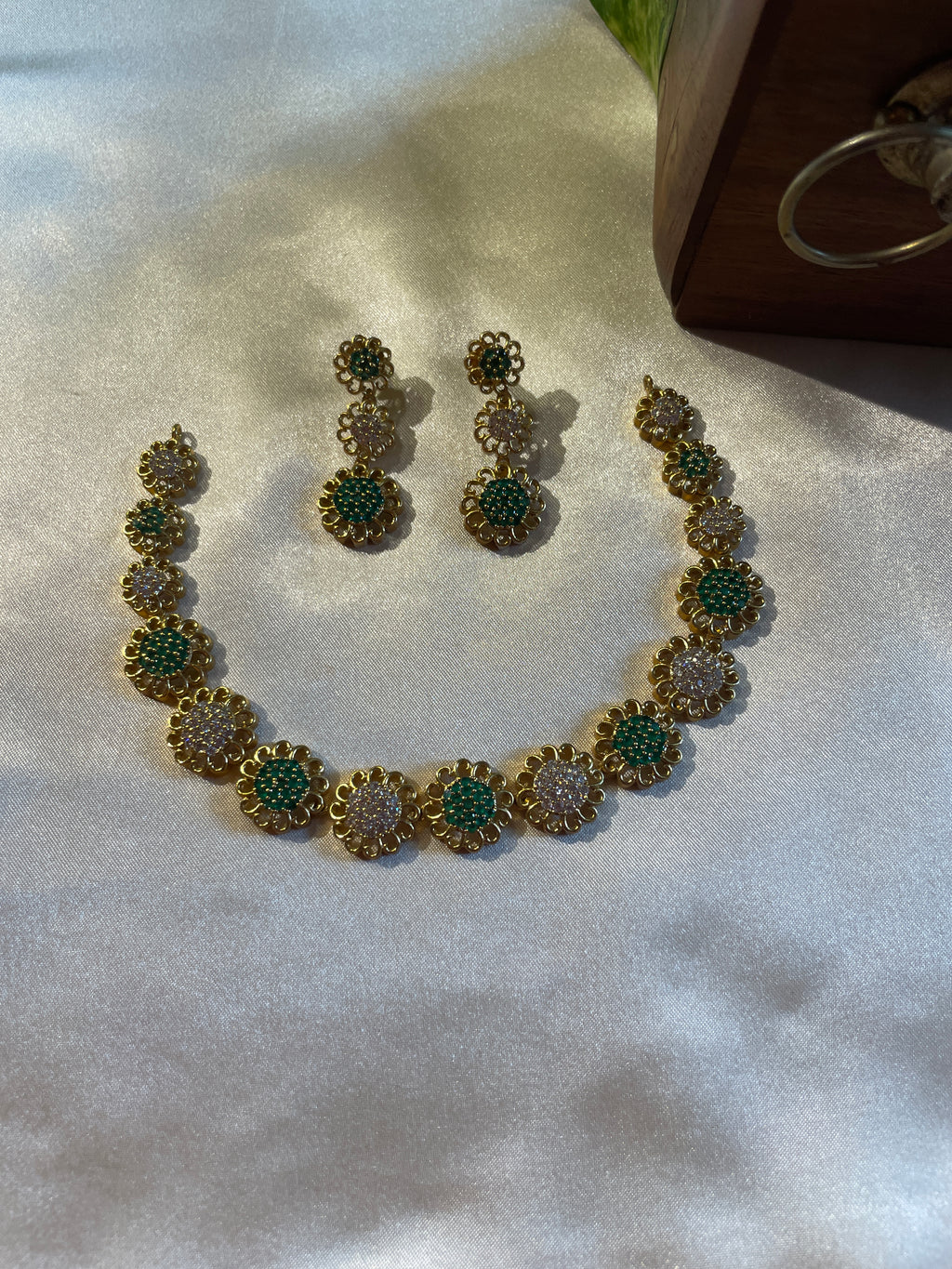 Neelima micro gold plated necklace set with green emerald and white AD stones with matching earrings