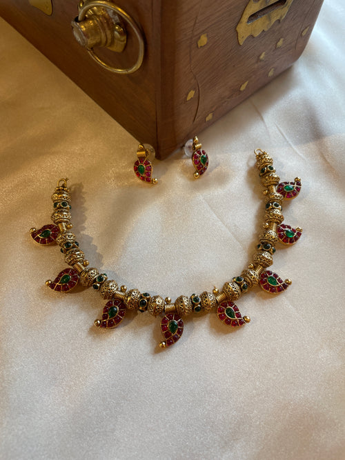 Aadhira gold micro plated mango mala necklace set with ruby-coloured and emerald-green semi-precious stones and matching earrings